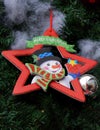 Christmas tree decoration with snow man and red star background Royalty Free Stock Photo