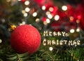 Closeup of Christmas tree decorations with Merry Christmas sign Royalty Free Stock Photo