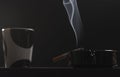 Closeup of cigarette on ashtray with a beautiful wisp of smoke Royalty Free Stock Photo