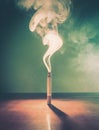 Closeup cigarette on the table emits dense toxic smoke in the room. Smoking danger concept. Addiction to poisonous tobacco Royalty Free Stock Photo