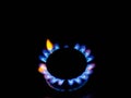 Closeup of circular burner blue and yellow flame