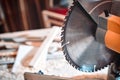 Closeup of a circular saw in a carpentry workshop.