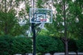 a closeup of a city park outdoors basketball hoop at sunrise