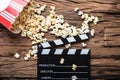 Clapperboard And Popcorn On Wood Representing Movie Time Royalty Free Stock Photo