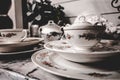 Closeup of classic antique pattern china set with plates and teacups