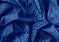 Closeup classic blue macro texture of blue jeans material fabric or clothing. Toned trendy 2020 year colour background with Royalty Free Stock Photo