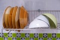 Closeup of the cleaned dish and blow are drying on the stainless dish drainer Royalty Free Stock Photo