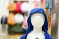 Closeup clear face of boy mannequins wearing the childhood clothes design with blurred background of the shop