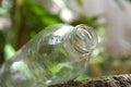 closeup clear glass bottle isolated on blurred background