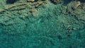 Closeup of the clear teal water and the sands of the beach