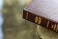 Closeup of closed Holy Bible Book with gold letters. Word of God and Jesus Christ. Royalty Free Stock Photo