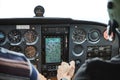 Closeup of a cockpit of cessna skyhawk 172 airplane with two pilots.