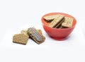 Selected focus on chocolate biscuits in a red cup on a white background Royalty Free Stock Photo