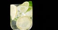 closeup of coctail. Mojito, tonik water with mint and lemon and lime and ice cubes