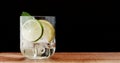 Closeup of coctail. Mojito, tonik water with mint and lemon and lime and ice cubes Royalty Free Stock Photo