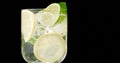Closeup of coctail. Mojito, tonik water with mint and lemon and lime and ice cubes