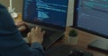 Closeup coding on screen, Man hands coding html and programming on two screen Monitors, development web, developer. Royalty Free Stock Photo