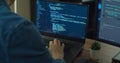 Closeup coding on screen, Man hands coding html and programming on two screen Monitors, development web, developer. Royalty Free Stock Photo