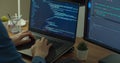 Closeup coding on screen, Man hands coding html and programming on two screen Monitors, development web, developer. Royalty Free Stock Photo