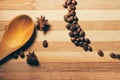 Coffee beans with anise and wooden spoon Royalty Free Stock Photo