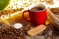 Closeup of coffee cup, biscuit and sugar spoon Royalty Free Stock Photo