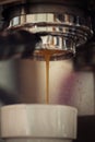 Closeup of coffee machine making espresso drink