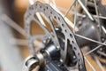Closeup cogwheel attached to bicycle wheel, mechanical repair concept