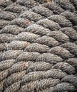 Closeup of coiled rope on a dock in New England Royalty Free Stock Photo