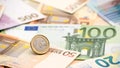 Closeup of a coin one euro with banknotes of different values. Cash money Royalty Free Stock Photo