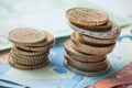 Coins piles and banknote in euro money