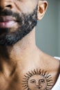 Closeup of collar bone tattoo of a man Royalty Free Stock Photo