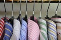 Closeup of collars of men's shirts hanging on a rail