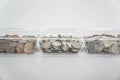 Closeup of a collection of coins in a glass container