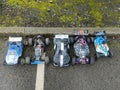 Closeup of a collection of toy cars on an asphalt