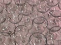 Closeup of collection of wine glasses in pink light fill the frame Royalty Free Stock Photo