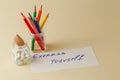 Closeup of color pencils in glass jar with notes Royalty Free Stock Photo