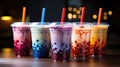 Closeup of a colorful assortment of bubble boba milk tea cocktail drinks
