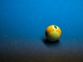 Closeup of colorful billiard balls on blue pool table in daylight Royalty Free Stock Photo