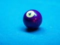 Closeup of colorful billiard balls on blue pool table in daylight Royalty Free Stock Photo