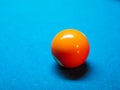 Closeup of colorful billiard balls on blue pool table in daylight Royalty Free Stock Photo