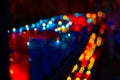 Closeup of colorful candles burning in the tunnel of Covadonga, Cangas de Onis, Asturias, Spain. Spirituality Royalty Free Stock Photo