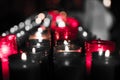 Closeup of colorful candles burning in the tunnel of Covadonga, Cangas de Onis, Asturias, Spain. Spirituality Royalty Free Stock Photo