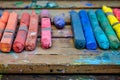 closeup of colorful chalks on wooden artists palette Royalty Free Stock Photo