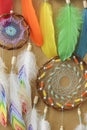 Closeup colorful dreamcatcher details on striped craft wrapping paper background