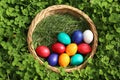 Closeup of colorful eggs in beautiful spring meadow on easter holiday outdoors in green graas.Traditional symbol for christian and