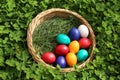 Closeup of colorful eggs in beautiful spring meadow on easter holiday outdoors in green graas.Traditional symbol for christian and