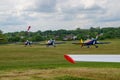 Closeup of colorful Extra EA-300 airplane models at Hangariada aeronautical festival show