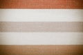 Closeup of colorful gray orange white striped textile as background or texture Royalty Free Stock Photo