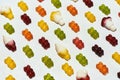 Closeup of colorful gummy bears and ice cream jelly candies lying diagonally isolated on white background Royalty Free Stock Photo