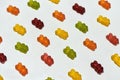 Closeup of colorful gummy bears jelly candies scattered diagonally isolated on white background Royalty Free Stock Photo